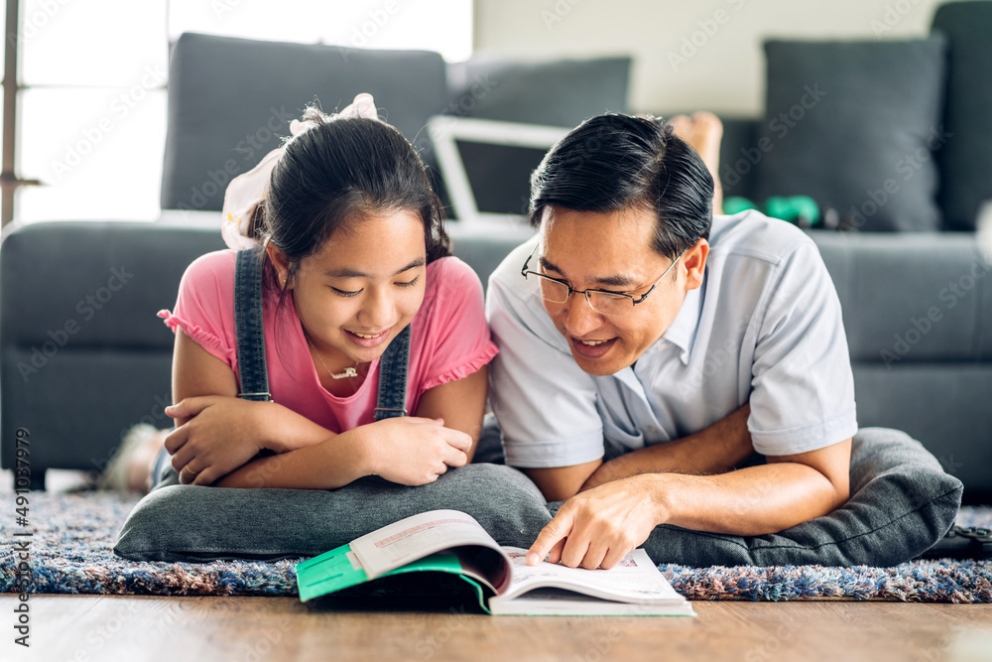 father and daughter reading together