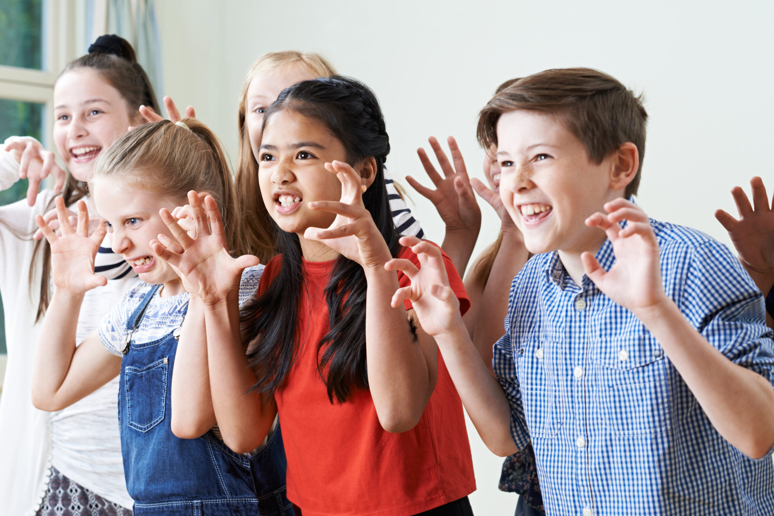 Group Of Children Enjoying Drama Club Together