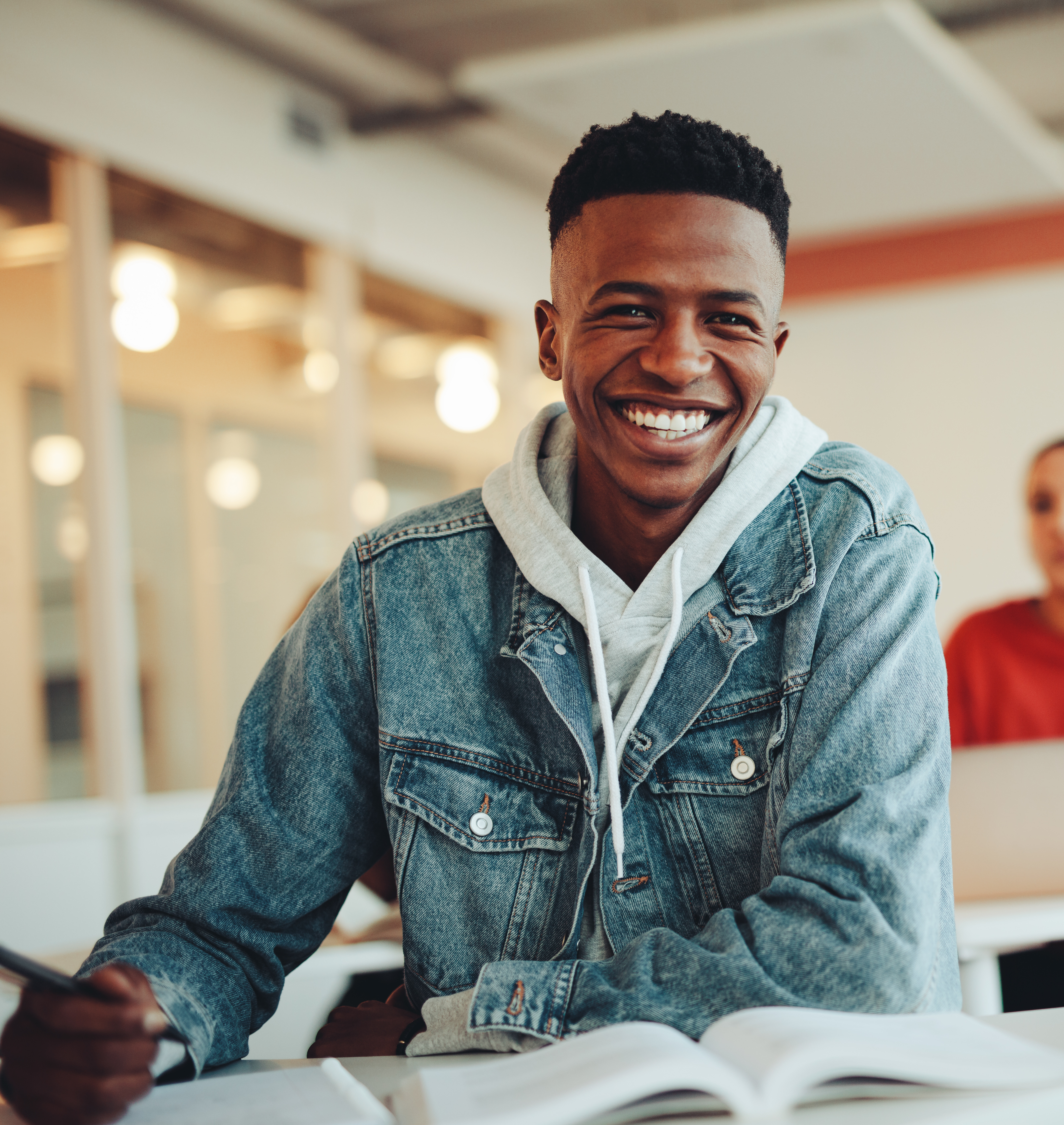 smiling boy doing schoolwork