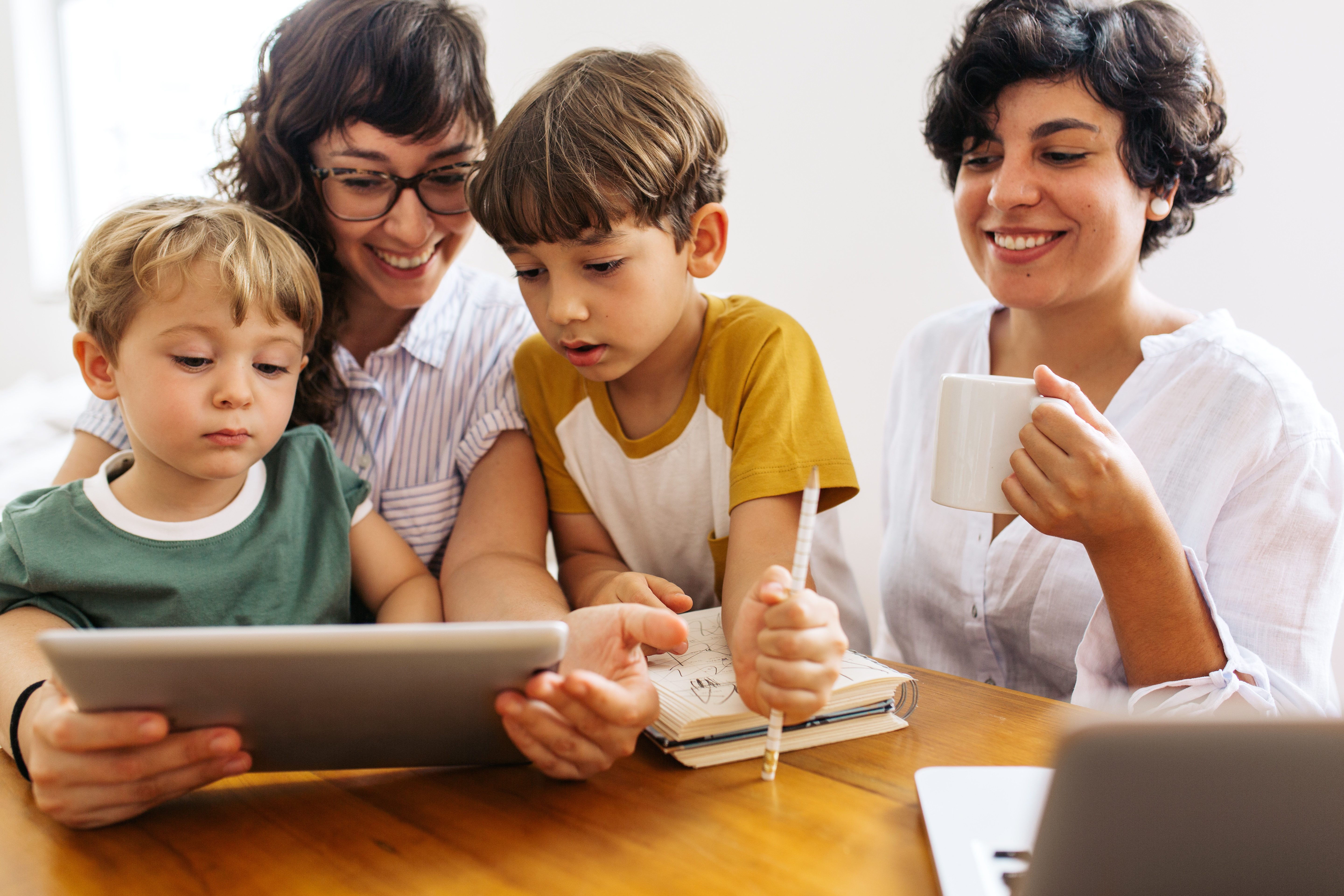 Young family at home with digital tablet