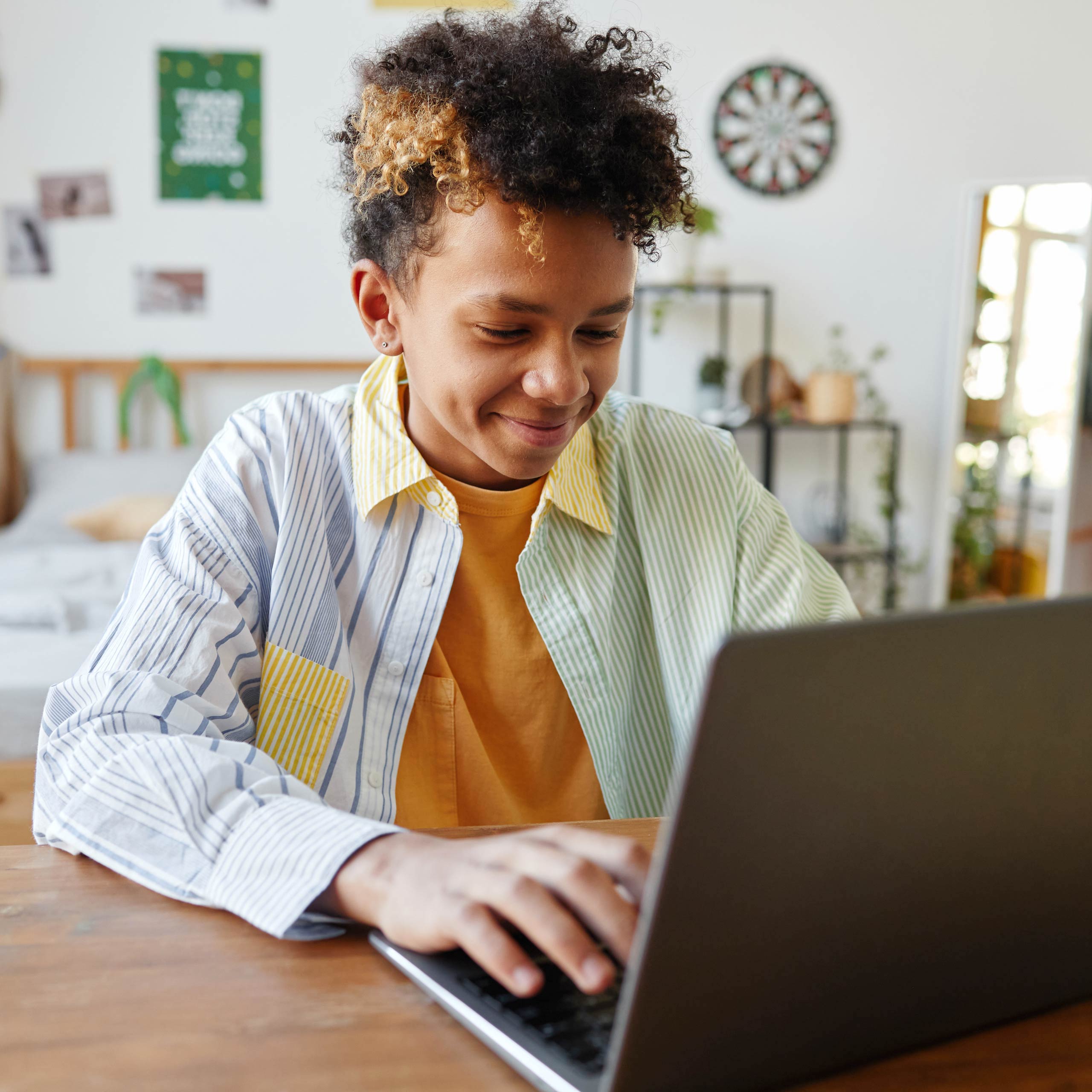 boy smiling at the computer